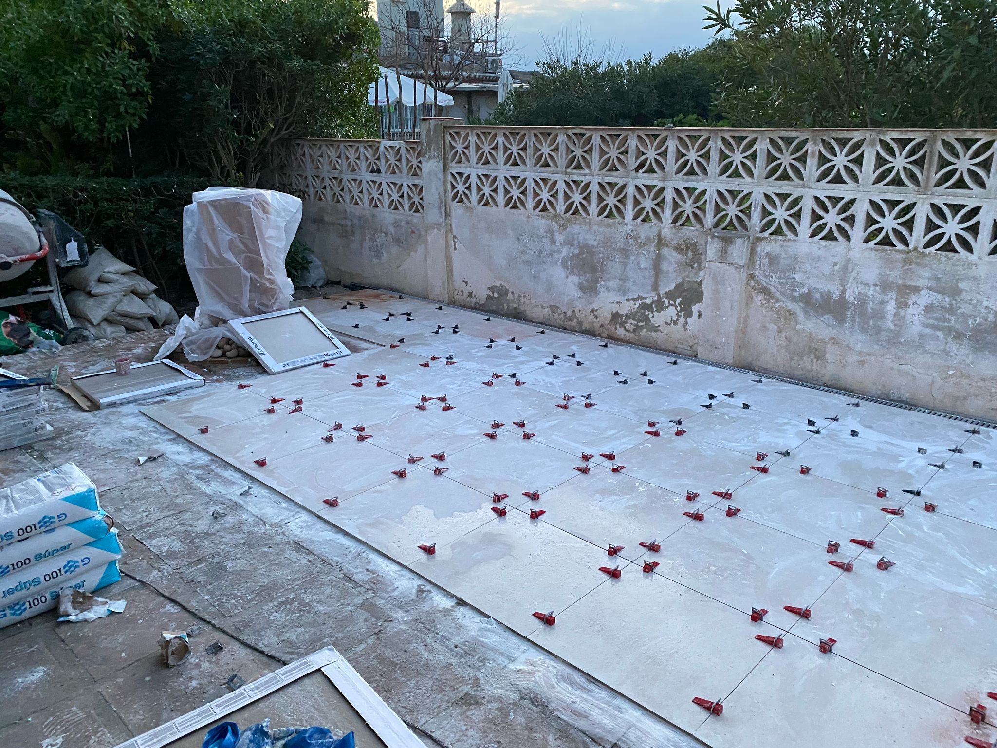 Terrace tiles being installed with levelling spacers